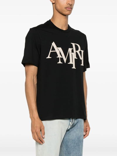 Amiri – Beiges T-Shirt mit gestaffeltem Logo-Print in Schwarz