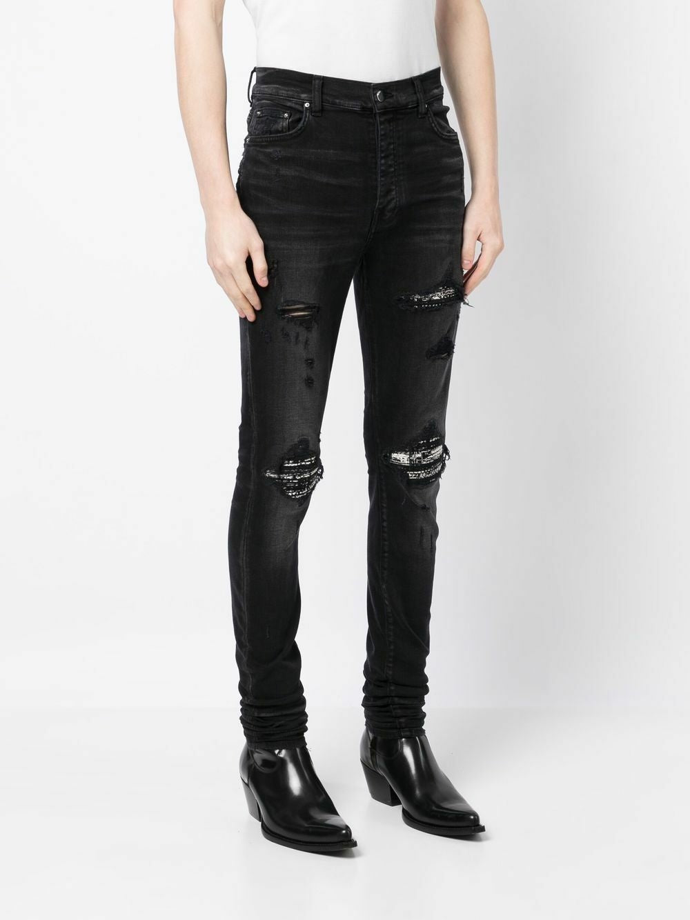 Amiri – Bouclé-MX1-Jeans mit Rissen in Schwarz
