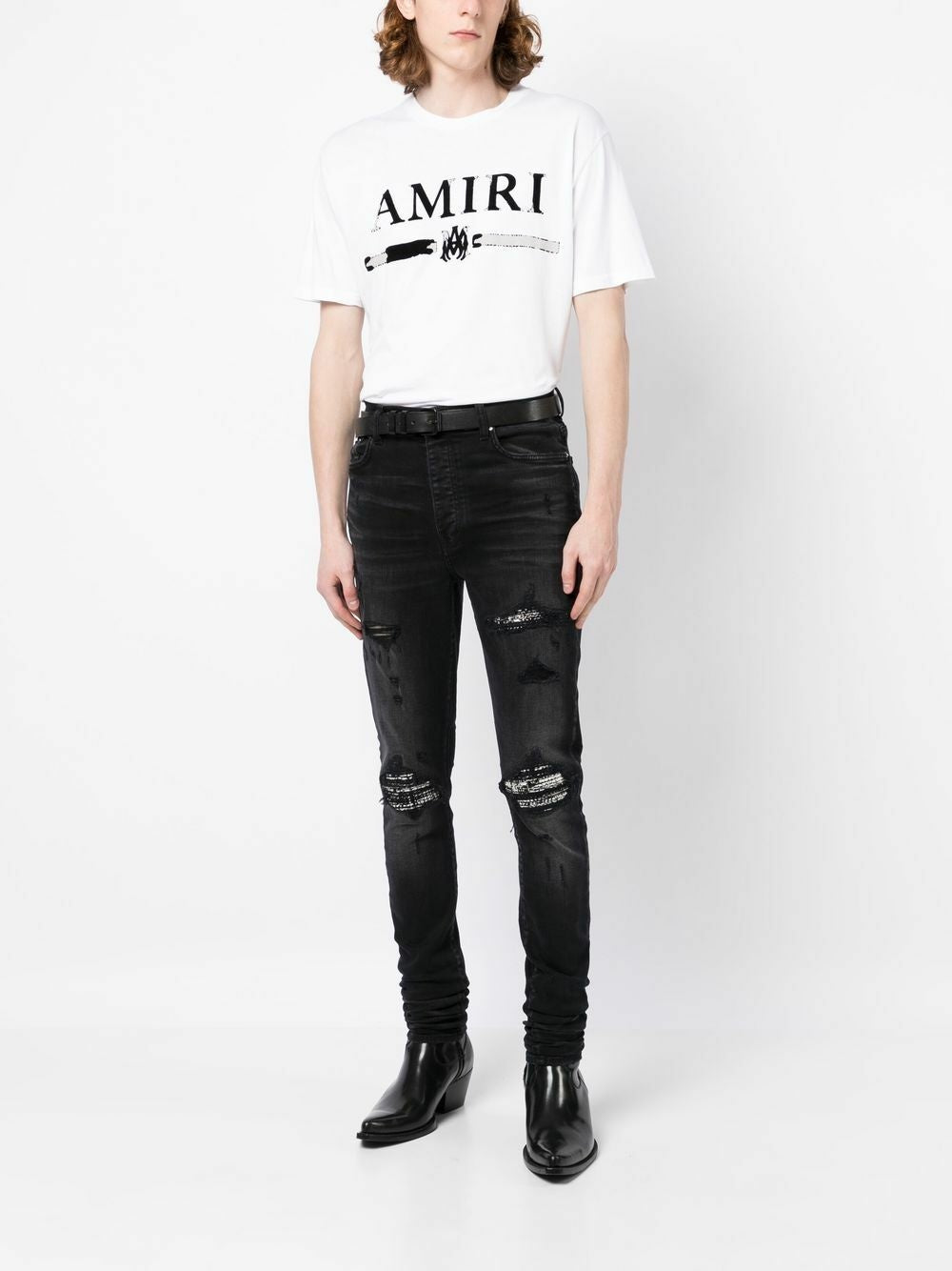 Amiri – Bouclé-MX1-Jeans mit Rissen in Schwarz
