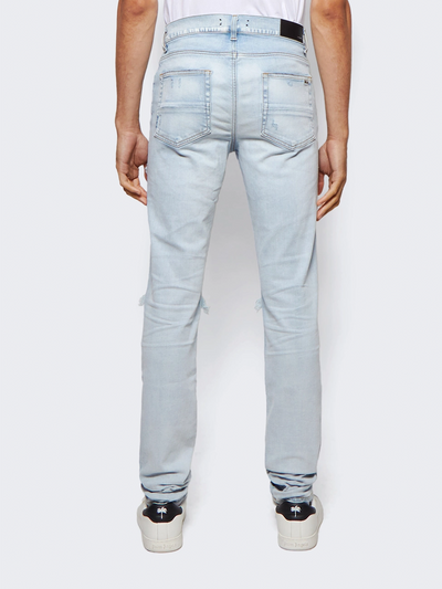 Amiri „MX1“ Jeans mit Camouflage-Patch in Hell-Indigoblau