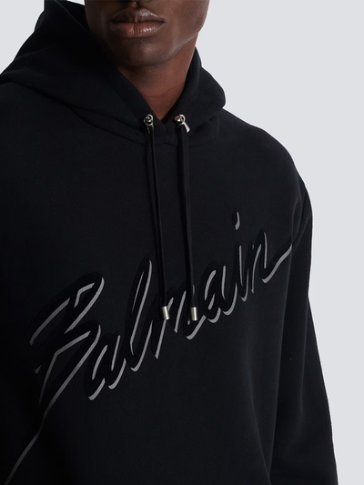 Balmain – Kapuzenpullover mit beflocktem Logo-Schriftzug in Schwarz
