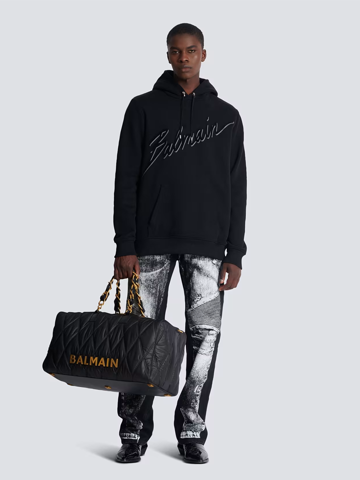 Balmain – Kapuzenpullover mit beflocktem Logo-Schriftzug in Schwarz