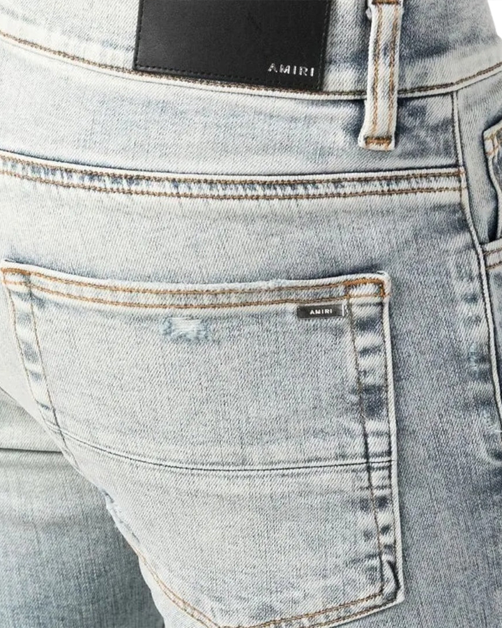 Amiri – MX1 – Zerrissene Jeans in Stone Indigo-Waschung in Blau