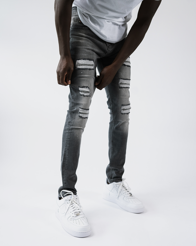 Magiri Douai – Graue Jeans mit zerrissenen Patches