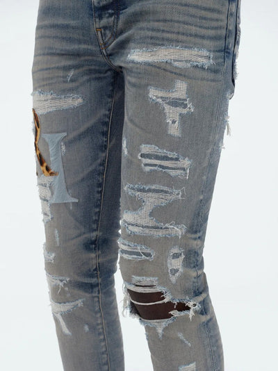 Amiri – Blaue Jeans aus Leder mit versetztem Logo