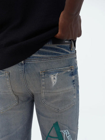 Amiri – Blaue Jeans aus Leder mit versetztem Logo