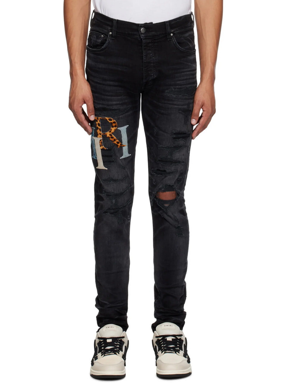 Amiri – Zerrissene Lederjeans mit versetztem Logo in Schwarz