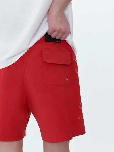 Amiri – Badeshorts mit Bones-Print in Rot
