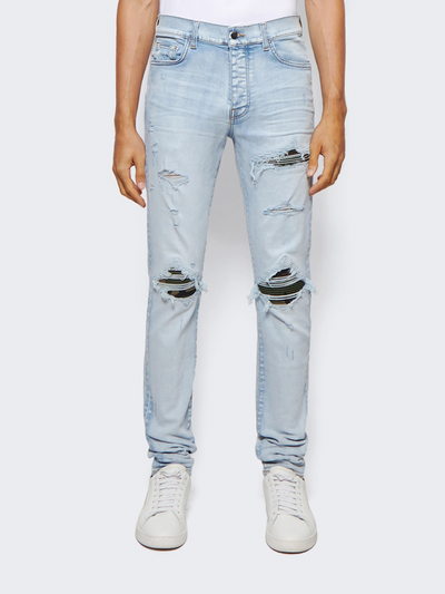 Amiri „MX1“ Jeans mit Camouflage-Patch in Hell-Indigoblau